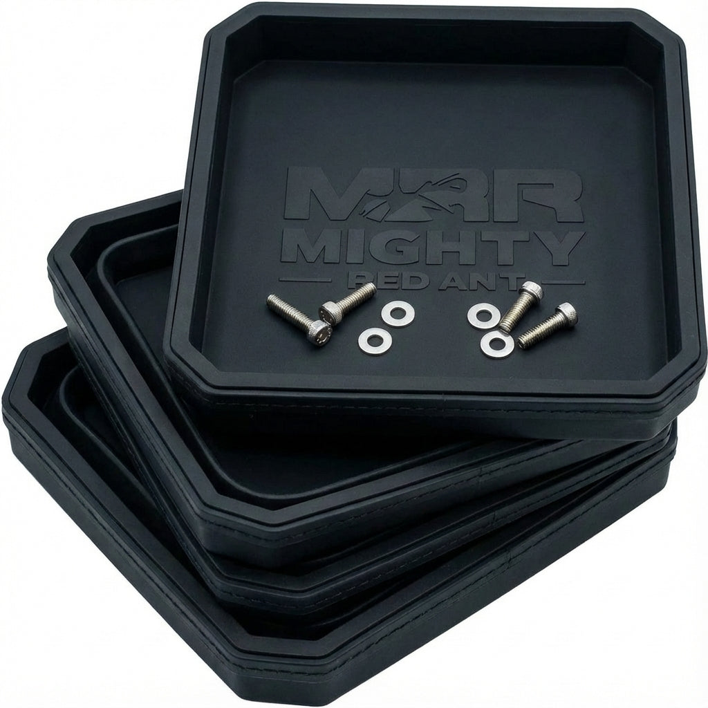 Four black magnetic parts trays stacked, the top one holding screws and washers
